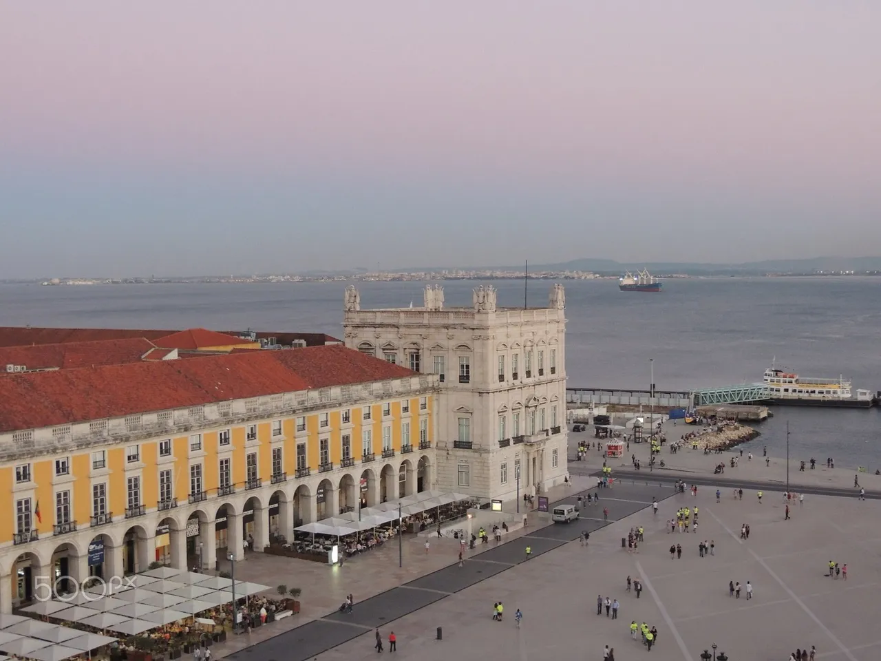 Sunlit rooftops and the waterfront in Lisbon